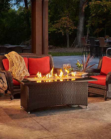 Montego Gas Fire Table by the Outdoor GreatRoom Company in a lifestyle setting